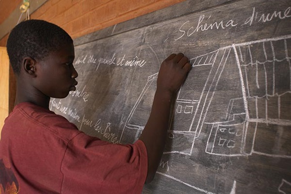 Student in african school. Illustration for the positive effect of IRBC agreements.