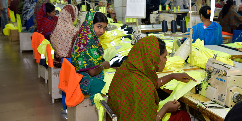 Bangladeshi garment workers work in a factory in Ashulia, Dhaka, Bangladesh